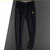 Printemps Automne Hommes Pantalons Designer Pantalons de survêtement Imprimer Sport Rétro Pantalon ample High Street Joggers Femmes Couple Pantalon Hip Hop Streetwear Taille asiatique M-4XL