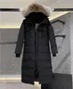 Högkvalitativ designer Kvinnor Down Jacket Fashion Märke Lång kappa Stor Pocket Päls krage termisk topp kvinnlig stora vindtäta vinterjackor rockar