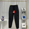 Moda casual diseñador de hombres lujo otoño invierno hombres al aire libre bordado felpa engrosada prisa casual cálido pie corbata pantalones chaopai impermeable