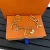 Klassisk M69008 Monogram V Keychains Women's Designer Högkvalitativ bärbar nyckelring Luxury Metal Snowfakes Circle Key Ring