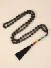 Pendentif Colliers Yuokiaa 108 pierres volcaniques naturelles de lave noire collier de pompon noué à la main avec sept chakras bouddha spirituel