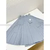 Spódnice Poczucie odzieży roboczej plisowana spódnica 2024 Nisza wczesna wiosna Projekt wysokiej talii z wieloma ciałami
