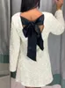 Robes décontractées Brillant Paillettes Dos Creux Out Bowknot Mini Robe Femmes À Manches Longues Slim Court 2024 Femme Vacances Soirée Soirée Looks