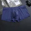 Underbyxor män is silkekonvex påse boxare shorts för unga elastiska underkläder ultratunna trosor pojkens sexiga transparenta gasy sport