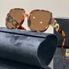 Mode lyxdesigner solglasögon för kvinnors män glas samma solglasögon som Lisa Triomphe Beach Street Photo Små sunnies metall full ram med presentförpackning