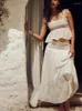 Arbetsklänningar vita två stycken uppsättningar 2024 ärmlös broderad spaghetti rem sexig topp och maxi elastisk kjol elegant lång klänning strand kostym