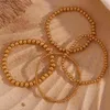 Charm-Armbänder 2023 Beliebte vergoldete silberne Farbe elastische Perlenarmbänder Armreifen für Frauen Wasserdichtes Edelstahl-Perlenkettenarmband
