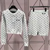 Kvinnors tvådelade byxor Designer Mi * MI 2023 Autumn/Winter New Polka Dot Jacquard Sticked Cardigan Jacket Top+Short Kirt Tvådelar Set for Women J54s