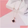 Venta al por mayor Moda Mujer Joyería Tarnish Titanio Acero Trébol de cuatro hojas Blanco y negro Collar colgante de doble cara Entrega de gota DHQSV