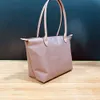 Designer di lusso Handags Hualongxiang Borsa per gnocchi in nylon con manico medio lungo Borsa da donna pieghevole in stoffa impermeabile con una spalla di grande capacità