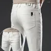 Calças de brim masculinas 2024 estilo branco verão homens algodão negócios estiramento fino ajuste calças jeans calças casuais marca masculina