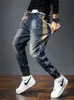 Męskie dżinsy haremowe spodami mody kieszenie desinger luźne fit w lupgy moto dżinsy mężczyźni men retro streetwear relaksowane zwężające się dżinsy 240115