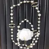 Pendenti di design di marca di lusso placcato oro 18 carati Collane di canale Perla di cristallo Acciaio al titanio Lettera C Collana girocollo Collana con pendente Catena di maglioni Accessori per gioielli