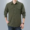 Camicie cargo da uomo a maniche lunghe Camicia casual solida Camicia da lavoro oversize da uomo Tasca da lavoro da uomo Abbigliamento militare da trekking uomo 240115