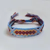 Charm Armband Europe och USA Columbia Wind Webbing Armband Kvinnlig handvävd etnisk stil Geometrisk färg Tassel L