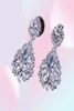 Merksieraden Bloemvorm Lady039s 925 Sterling zilveren Klauw set Witte steen 5A Zirkoon steen Bruiloft Dangle Oorbellen Cadeau E117220922