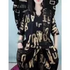 Traje de mujer versión coreana de verano Tops holgados con estampado pantalones Harem dos conjuntos a juego Ropa de talla grande a la moda para mujer 240117