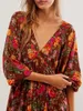 Robes décontractées Col V Floral Mini Robe Femmes Boho Volants Flowy Court Dos Nu Manches Longues Lâche A-Line Swing