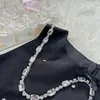 夏の女性ドレスデザイナースカートダイヤモンドレター刺繍入りグラフィックノースリーブドレスカジュアルスリムな小さな丸いネックドレス