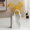 Wazony minimalistyczny torebka kształt wazonu ceramiczny kreatywne garnki roślinne dekoracja dekoracyjna układ kwiatowy wazony kwiatowe doniczki YQ240117