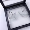 Hommes Triangle inversé Pendentif Colliers Boucles d'oreilles Bijoux de créateur Mode de luxe pour femme Marque Bijoux Personnalité Clavicule Chaîne Boucles d'oreilles