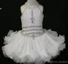 Elegancka biała babeczka Toddler Controsels Sukienki kantarki koralikowe suknia księżniczka Pierwsza święta Komunia Krótka dziewczyna Flower Gowns For Wedding3107586