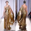 Zuhair Murad Apliques de alta costura Vestidos de noche dorados Sirena larga Un hombro con apliques Vestido de fiesta vintage transparente186z