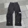 Pantalons pour hommes Harajuku Streetwear Multiples poches Pantalon droit à jambe large Femme Jeans amples Y2K Noir Rétro Lettre Impression Pantalon Cargo T240117