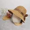 Chapeau de pêcheur tissé en paille avec nœud papillon, chapeaux de seau de mode d'été de styliste pour femmes, tenues de plage, casquette de soleil ajourée à large bord