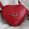 Famoso bolso cruzado Bolsos de hombro de alta calidad para mujer Bolsos Nuevo Saturno Patrón de cocodrilo Bolso de mano de cuero lacado Vi para el Día de San Valentín Día de la Madre