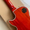 Guitare électrique rouge transparente classique, avec du matériel doré de haute qualité, confortable au toucher, son émouvant et livraison rapide.