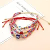 Charm-Armbänder YASTYT Mehrschichtiges Armband Lucky Eye Modeaccessoires Bunte Perlen für Frauen Schnürarmreif Weihnachtsgeschenke