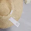 Chapeau de pêcheur tissé en paille avec nœud papillon, chapeaux de seau de mode d'été de styliste pour femmes, tenues de plage, casquette de soleil ajourée à large bord