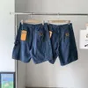 A 2023 Verano Nueva marca de moda Multi bolsillo lavado ropa de trabajo vieja Jeans y Capris