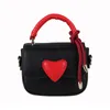 Sacs de soirée Sac cadeau Saint Valentin Mini sac à main mignon en forme de coeur Fermeture à loquet Printemps Été Couleur Bonbon Bandoulière En Gros