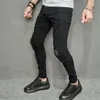Pantaloni da uomo streetwear alla moda con fori neri skinny jeans da uomo da jogging primaverili pantaloni casual in denim a matita pantaloni da uomo 240117