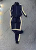 24SS Europe Designer Damen Tracksuits Luxus Sportanzug Zipper Streetwear Windbreaker Seitengurt -Tracksuit Frauen reflektierende atmungsaktive Sportanzüge reflektiert