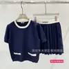 Designer feminino suéteres miu casa alta edição 2024 início da primavera manga curta saco falso de malha lã top meia saia conjunto azul vzgr
