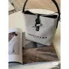 Designer de luxe Handags Longxiang Roseau série sac à main bandoulière unique épaule toile bambou joint seau femmes sac