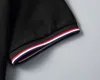 メンズポロシャツデザイナーマンファッションTシャツカジュアルゴルフポロスシャツチェストバッジトップトップ黒と白のソリッドカラーティーアジアサイズM-3xl