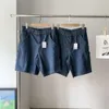 A 2023 Verano Nueva marca de moda Multi bolsillo lavado ropa de trabajo vieja Jeans y Capris