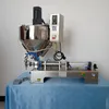 Electric semi automatic big bag powder filler vertical heating and mixing paste filling machine with mixer