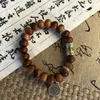 Strand UMQ Handcrafted Bracelet With Yabai Wood Abacus Beads And Tibetan Silver