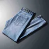 Jeans para hombres Jeans para hombres diseñador Primavera 23 nuevos pantalones de moda coreana para jóvenes de tubo recto pequeño y ajustado elásticos versátiles para hombres