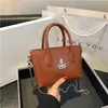 2023 New Fashion Mini Tote West Saturn Vegetable Blue Handbag Chain واحد