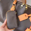 Bolsa de viagem de fim de semana de férias Bolsa tote de luxo Designer Pacotes ao ar livre Bolsa de bagagem unissex de grande capacidade Bolsas de viagem de couro genuíno Mulheres Homens Bolsa de moedas com zíper