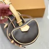 Diseñador Mujer Guisantes Pochette Bolso de hombro compuesto Francia Marca de lujo L Lienzo Flor Bolsa impresa Bolsas de media luna Lady Cowhide Correa de cuero Bolso de axila