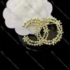 Spille a fiori alla moda scavate con strass a sei petali Perni di fiori Cappotto Pin per colletto Accessori decorativi per borse