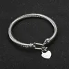 Itys – Bracelet en acier avec câble en titane, couleur or, breloque en forme de cœur d'amour, avec fermeture à crochet, bijoux de mariage pour femmes et hommes