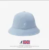 Дизайнерская рыбацкая шапка Kangol, которую можно носить в любое время года и унисекс.